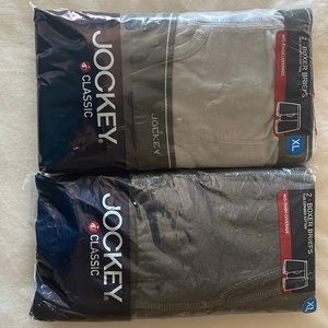 Two unopened packages of Jockey Classic boxer briefs mid thigh coverage